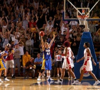Women's Basketball game in Harder Stadium with cheering fans